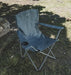 Outwell Spruce Folding Camping Chair - Fjord Blue - lifestyle image, showing chair outdoors