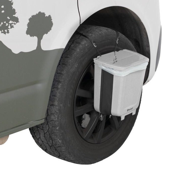 Outwell Collaps VanTrash Bin 8l - Collapsible camping bin lifestyle image of the bin attached to the wheel of camper