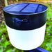 PLS Rechargeable Universal Windbreak LED Solar Light - lifestyle image, showing close-up of light affixed to windbreak pole, with focus on open USB recharging port
