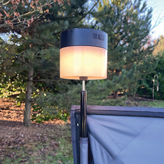 PLS Rechargeable Universal Windbreak LED Solar Light - lifestyle image, showing light affixed to windbreak pole emitting warm white light