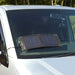 PV Logic 8W Fold-Up Solar Panel & Leisure Battery Maintainer - product image, shown in use on vehicle windscreen