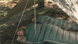 Robens Windscreen / Tarp shown as a tarp with a couple sleeping underneath