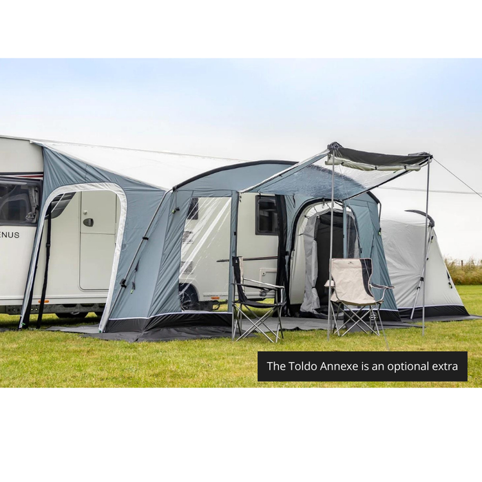 Sunncamp Toldo 390 Caravan Awning - Grey feature image of the awning viewed from the side with the left door fully unzipped and an optional extra annexe attached to the right side. the front door open with canopy up and two chairs in front. 