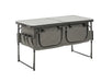 Travellife Toledo Wide Folding Camping Storage Unit – product image, showing a grey folding camp table with two front storage bins and side pockets, shown on a plain white background.