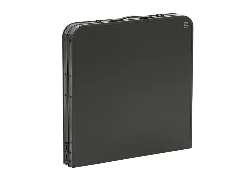 Travellife Toledo Wide Folding Camping Storage Unit – product image, showing a black folding table shown folded and standing upright, photographed on a clean white background.