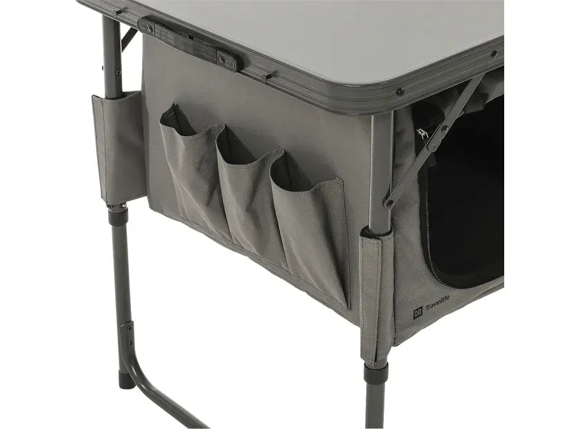Travellife Toledo Wide Folding Camping Storage Unit – product image, showing closeup of a grey folding table with a side storage pocket and organizer pouches, shown on a white background.