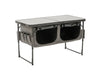 Travellife Toledo Wide Folding Camping Storage Unit – main product image, showing a grey folding camp table with two large black storage bins underneath and side utility pockets, shown on a plain white background.