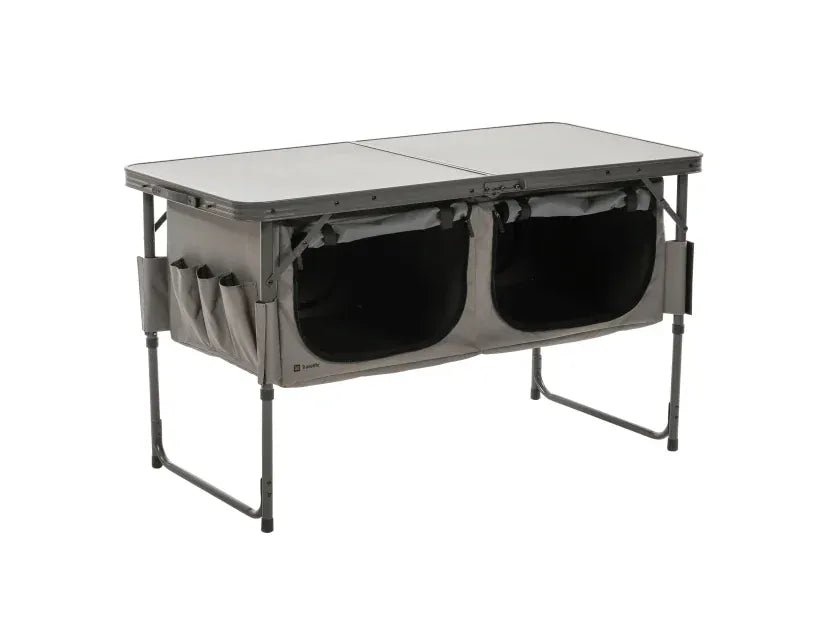 Travellife Toledo Wide Folding Camping Storage Unit – main product image, showing a grey folding camp table with two large black storage bins underneath and side utility pockets, shown on a plain white background.