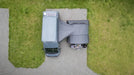 Vango Cove III Mid Drive Away Campervan Awning - lifestyle image, showing an aerial view of product with connecting tunnel, attached to vehicle