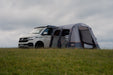 Vango Faros III Air Inflatable Drive Away Awning Cloud Grey - Low lifestyle image with all doors unzipped. awning attached to van and vent open on right side