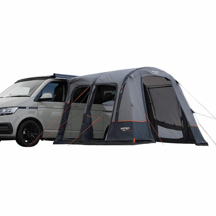 Van with an attached camping tent on a white background