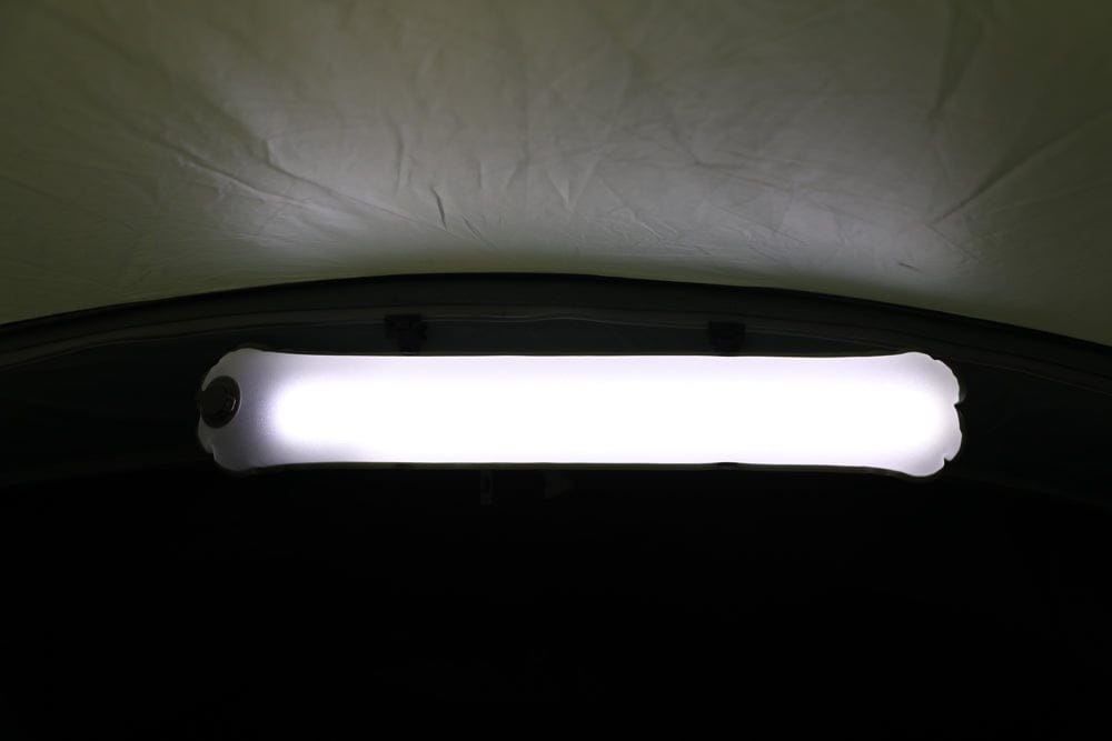 Vango Lightbeam 200 Recharge Camping Light - product image, shown in use with light turned on