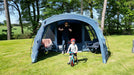 Vango Savannah 600XL 6-Person Family Tent Package - lifestyle image, showing adult and child inside tent entrance