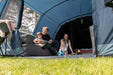 Vango Savannah 600XL 6-Person Family Tent Package - lifestyle image, showing family sat inside tent