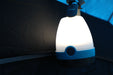 Vango Star 85 River Light - Camping Lantern Blue lifestyle image of lantern hanging in tent