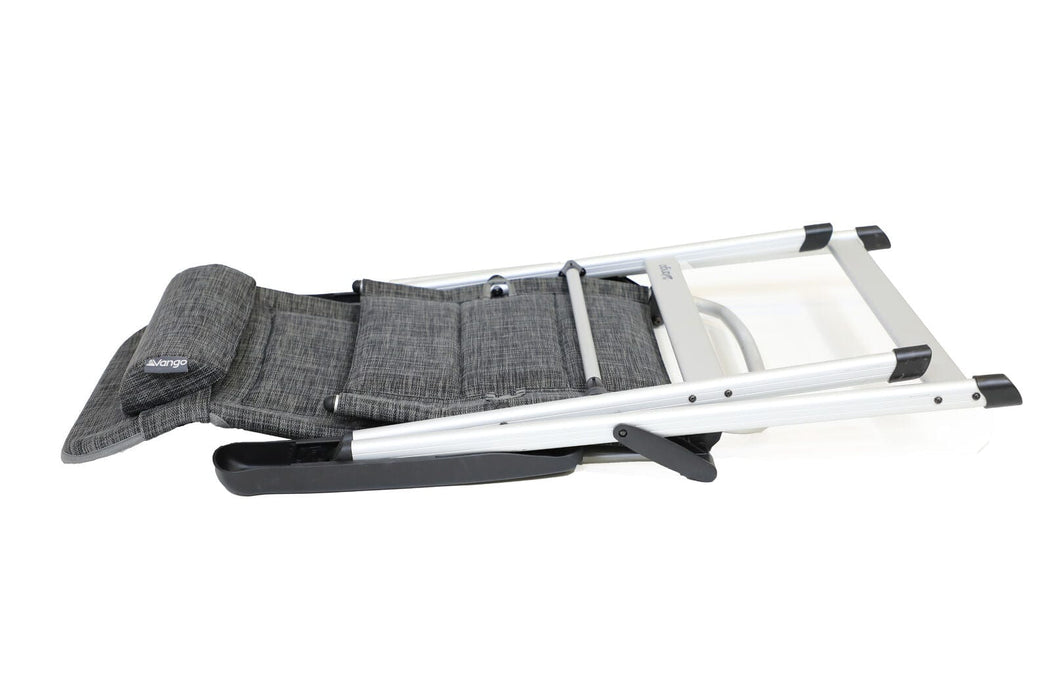 Folding recliner chair with gray fabric and white frame on a white background