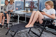 Isabella Bele Folding Footrest - Black lifestyle image inside awning in use