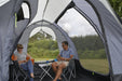 Kampa Travel Pod Tailgater Car Drive Away Tent - internal image couple sat on chairs inside