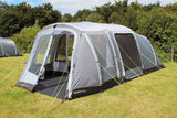 Outdoor Revolution Camp Star 500XL Inflatable Tent pitched on campsite showing side door with mesh bug protection and also front door  half open to porch area