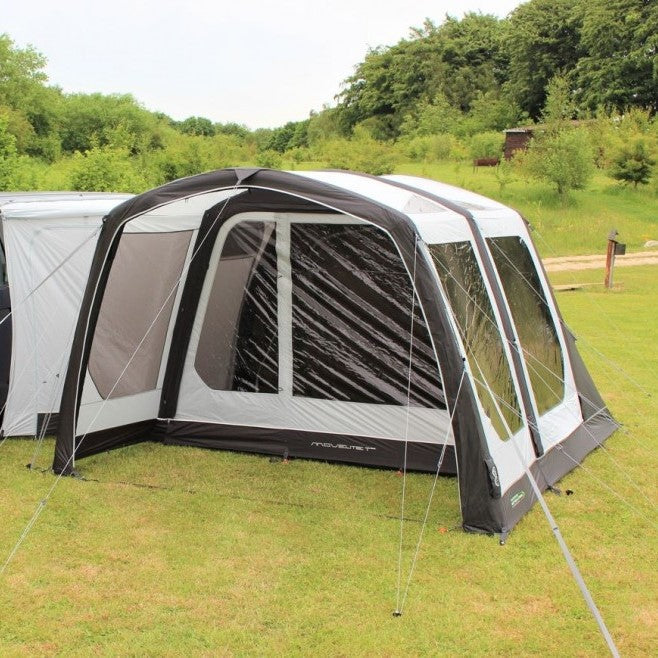 Outdoor Revolution Movelite T3E MID - Inflatable Drive Away Awning pitched on grass showing connecting corridor, clear winodws and porch canopy