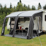 Outdoor Revolution Sportlite Air 320 pitched to caravan with example camping furniture and carpet