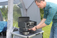 Outdoor Revolution Twin Burner Gas Stove & Grill shown being used 