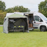 Quest Instant Screen House 4 - shown in front of a camper van and with example table and chairs inside