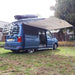 Sunncamp Sunnshield 240 Van Canopy - side view showing three poles and attached to a Transporter with Fiamma rail