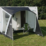 Sunncamp Swift 260 Caravan Canopy front view of canopy showing provision of shelter to the caravan entrance and also has example camping chair