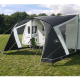Sunncamp Swift 390 Caravan Canopy pitched on campsite showing side windows and example chairs under canopy